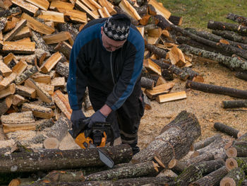 Man working at logs