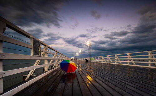 Pier over sea against sky