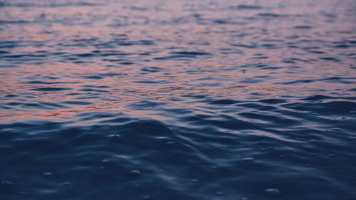 High angle view of rippled water at sunset