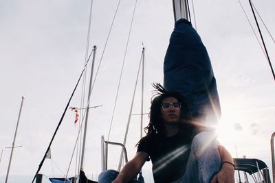 Young man with dreadlock on boat