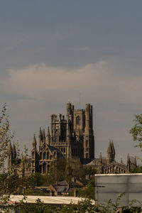 Buildings in city against sky