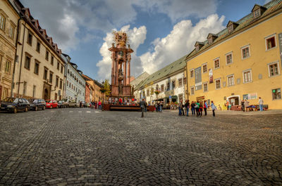 View of buildings in town against sky