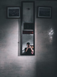 Portrait of woman on window