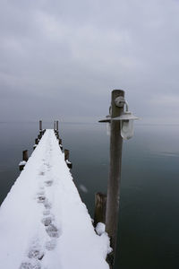 Stormy day with snow on lake chiemsee 
