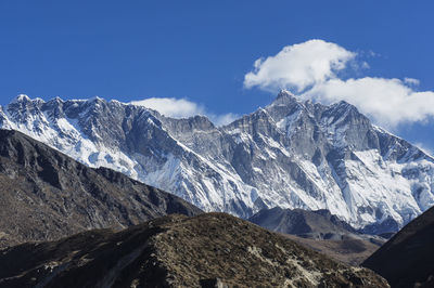 Majestic mountain range against blue sky