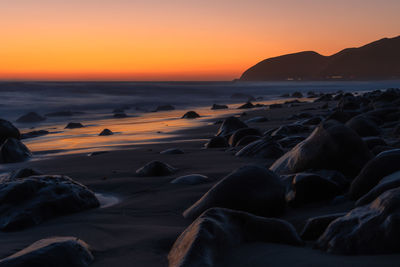 Scenic view of sea against sky during sunset