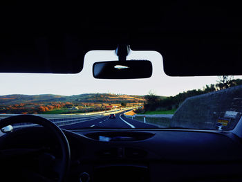 Road seen through car windshield