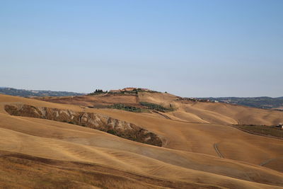 Scenic view of desert against clear sky