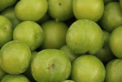 Full frame shot of granny smith apples for sale at market