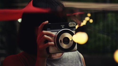 Midsection of woman photographing