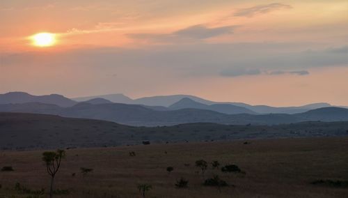 Scenic view of landscape against sky during sunset