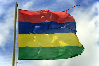 Low angle view of flag against sky