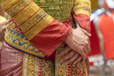 Close-up of woman holding umbrella standing outdoors