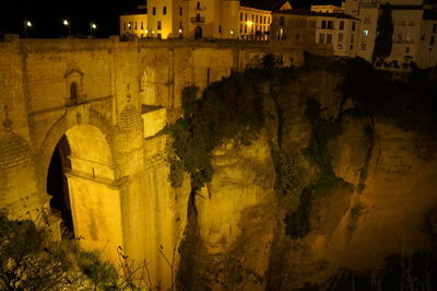 View of old buildings at night