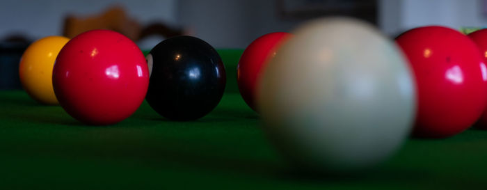 Close-up of multi colored balls on table