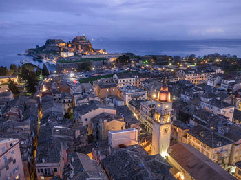 High angle view of illuminated buildings in city