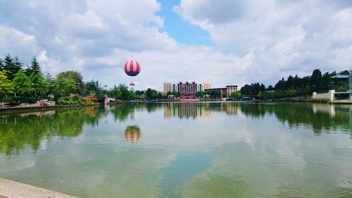 View over disney village lake against blue sky, disneyland paris