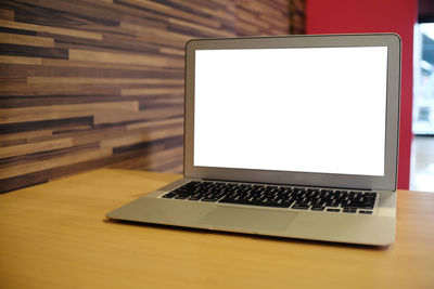 Laptop on table at restaurant