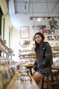 Young woman browsing albums in a record store