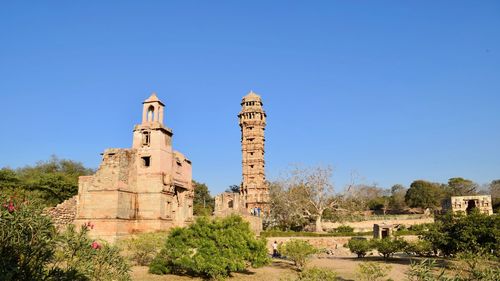 Low angle view of castle against clear blue sky