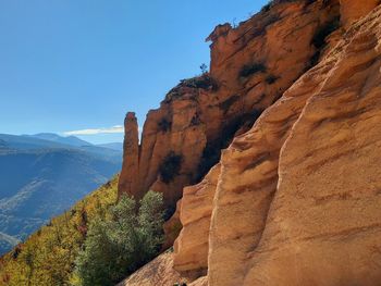 Rock formations on mountain against sky