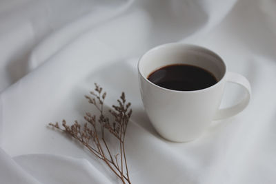 High angle view of coffee cup on table