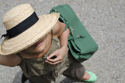 High angle view of boy wearing hat