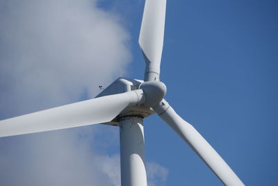 Low angle view of wind turbine against sky