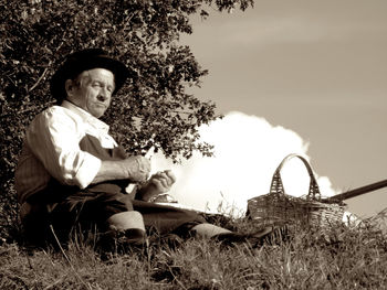 Young man sitting outdoors