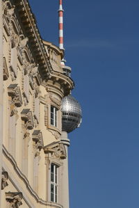 Low angle view of building against blue sky