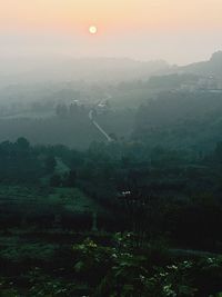 Scenic view of landscape at sunset