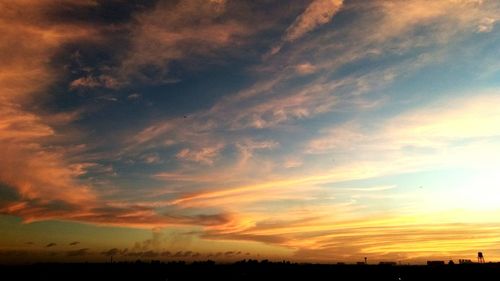 Low angle view of dramatic sky during sunset