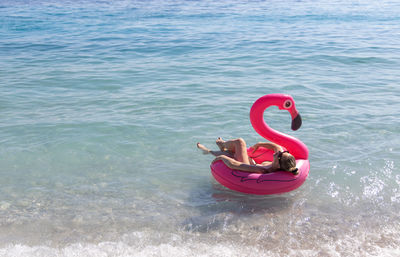 High angle view of man swimming in sea