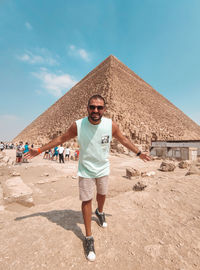 Full length of man standing on desert