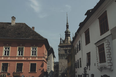 Low angle view of buildings against blue sky