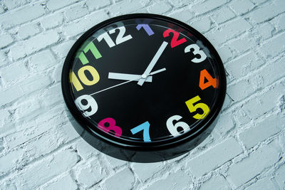Close-up of clock on wall