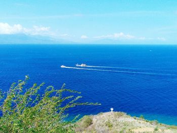 Scenic view of sea against blue sky