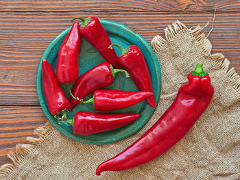 High angle view of red chili peppers on table