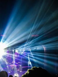 Aerial view of illuminated music concert at night