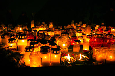 Illuminated tea light candles at night
