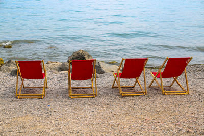 Empty chairs on beach