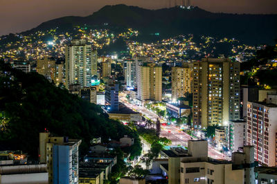 High angle view of illuminated buildings in city