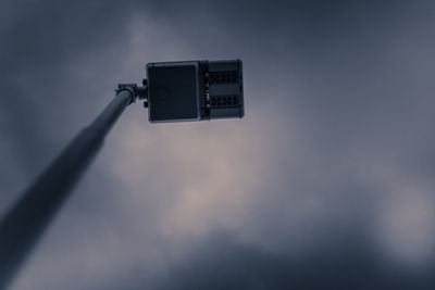 Low angle view of telephone pole against sky