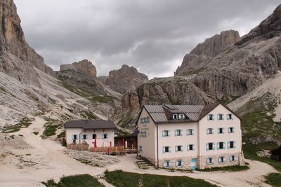 Built structure on mountain against sky