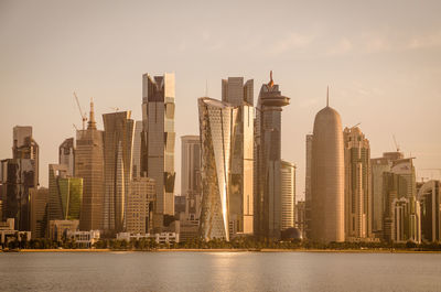 Modern buildings in city against sky