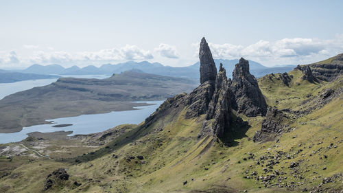 Panoramic view of sea and mountains against sky