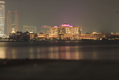 Illuminated buildings in city at night