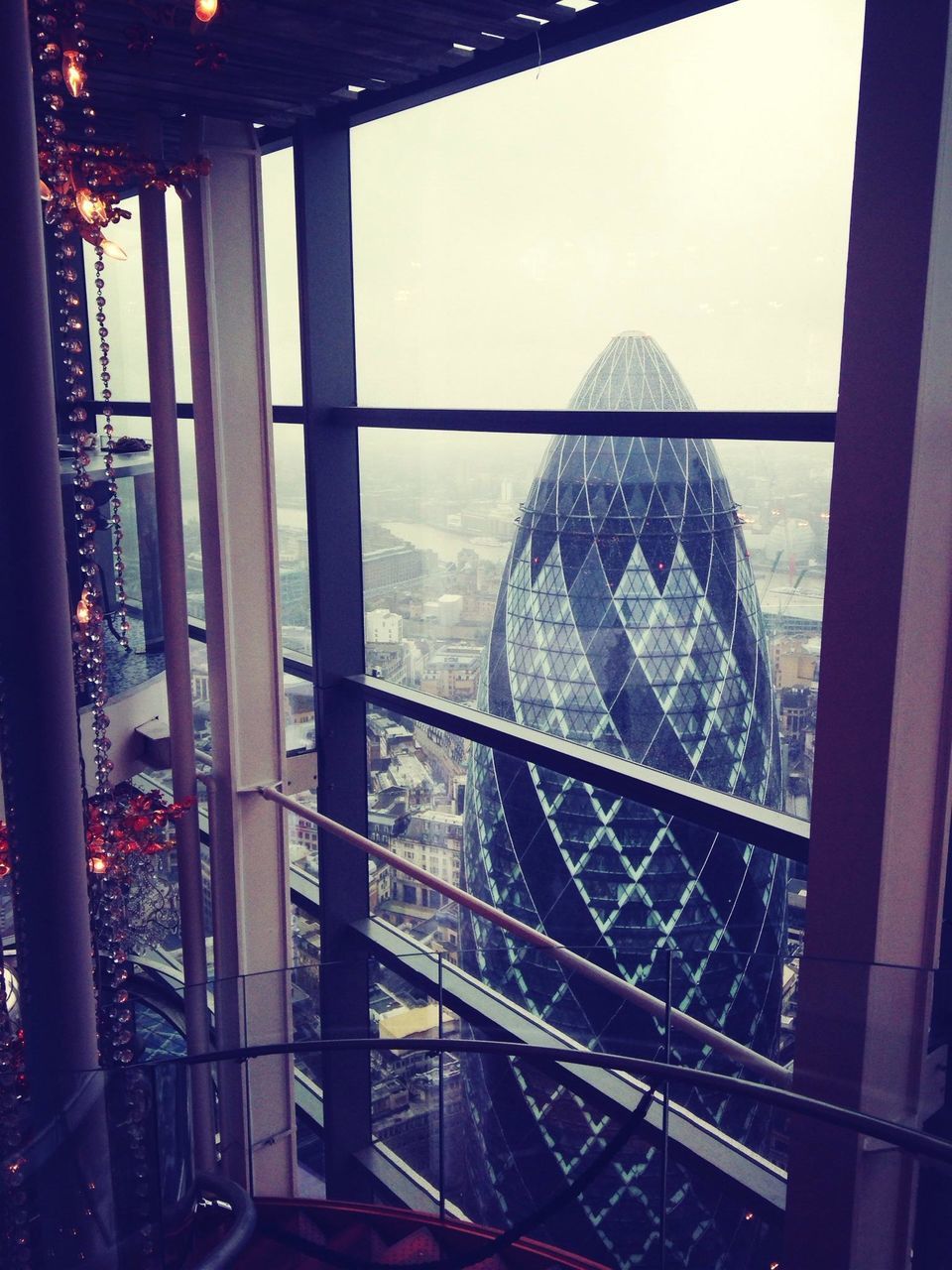 indoors, built structure, architecture, glass - material, window, transparent, metal, building exterior, transfer print, city, railing, auto post production filter, sky, famous place, cityscape, day, water, sunlight, travel destinations, no people