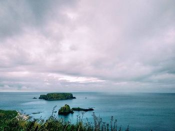 Scenic view of sea against cloudy sky