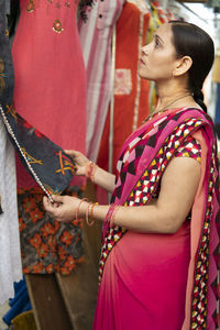 Side view of woman standing outdoors